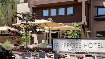 A row of bicycles parked in front of The Ambrose Hotel Santa Monica.