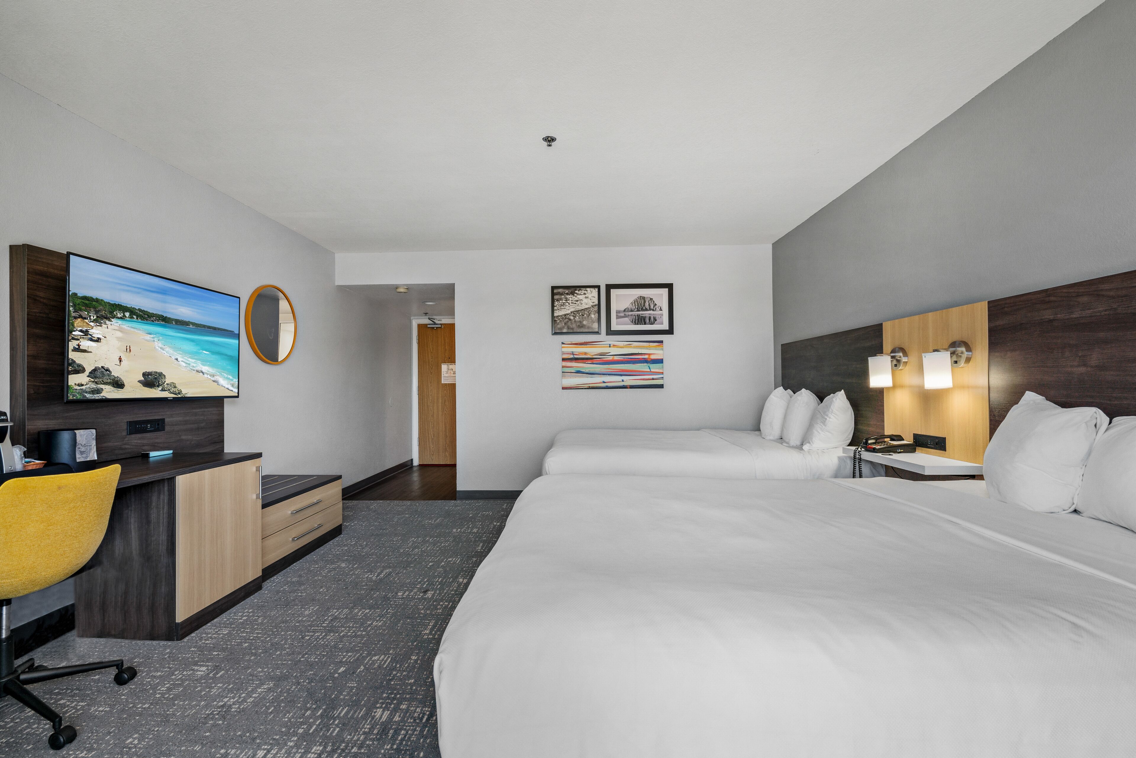 pillow-top beds, desk, laptop workspace, blackout curtains