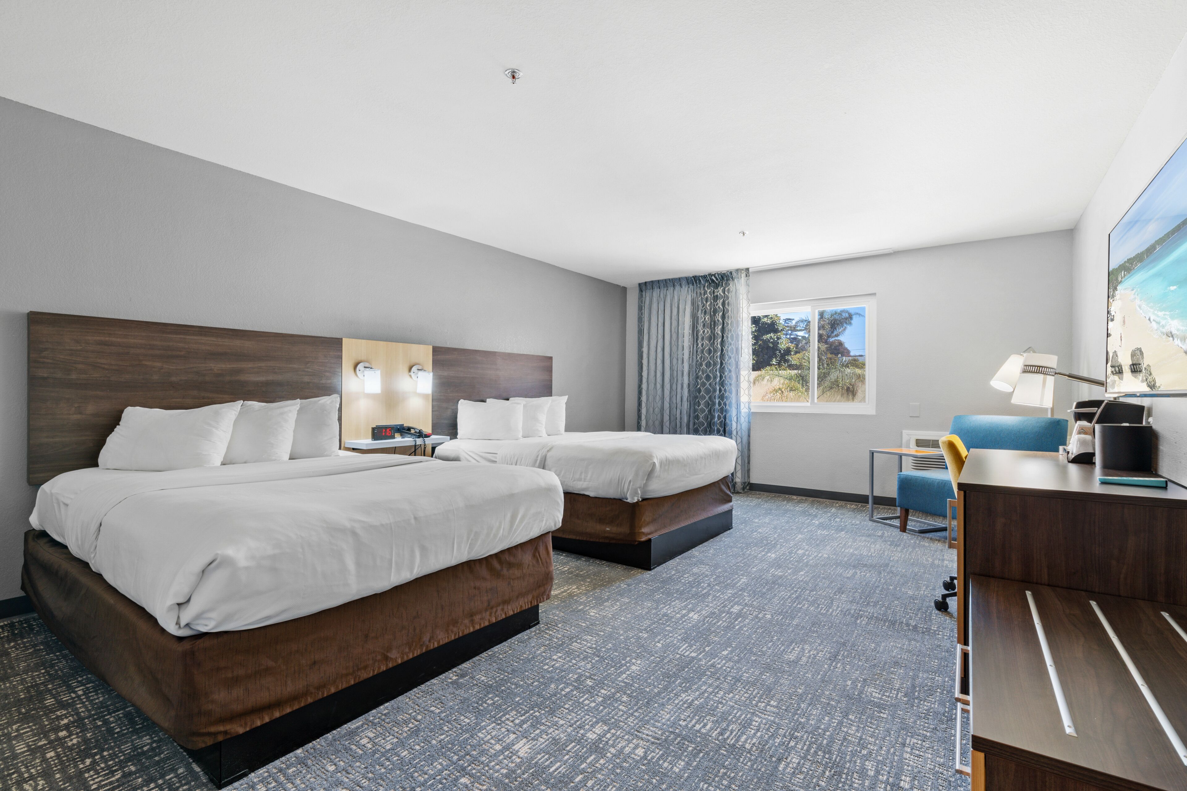 deluxe room, 2 queen beds | pillow-top beds, desk, laptop workspace, blackout curtains