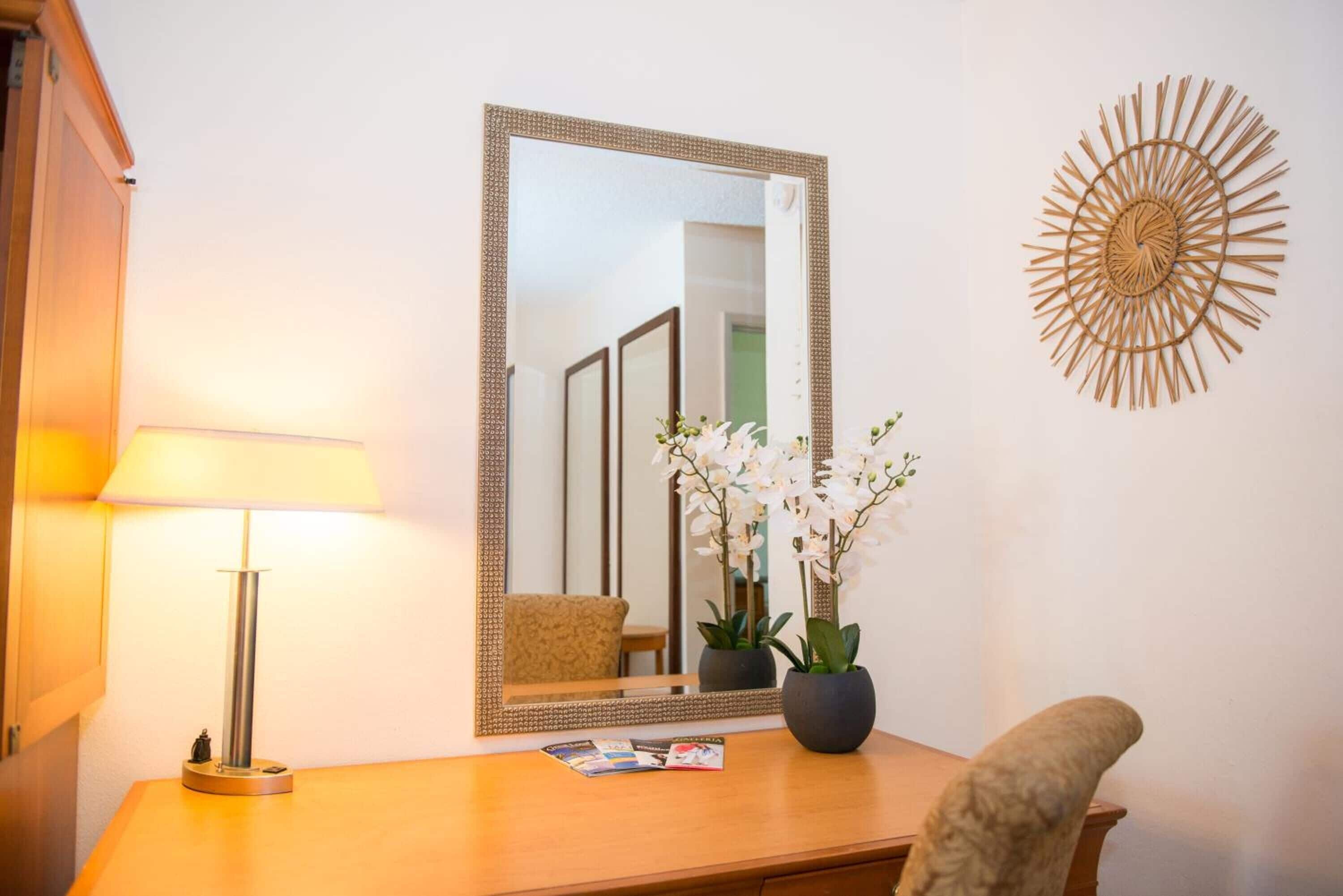 desk, laptop workspace, iron/ironing board, internet