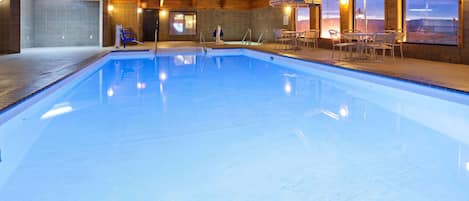 Indoor pool, open 7 AM to midnight, pool loungers
