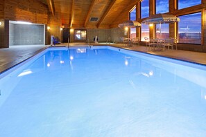 Indoor pool, open 7 AM to midnight, pool loungers