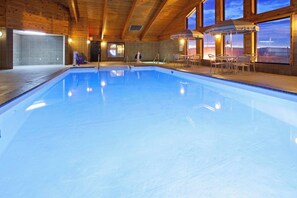 Indoor pool, open 7 AM to midnight, pool loungers