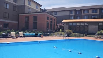 Seasonal outdoor pool, open 7:00 AM to 9:00 PM, pool umbrellas