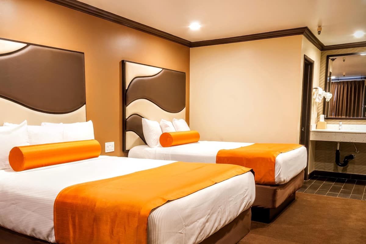 Deluxe Room With 2 Queen Beds | Pillowtop beds, desk, iron/ironing board, WiFi (free)