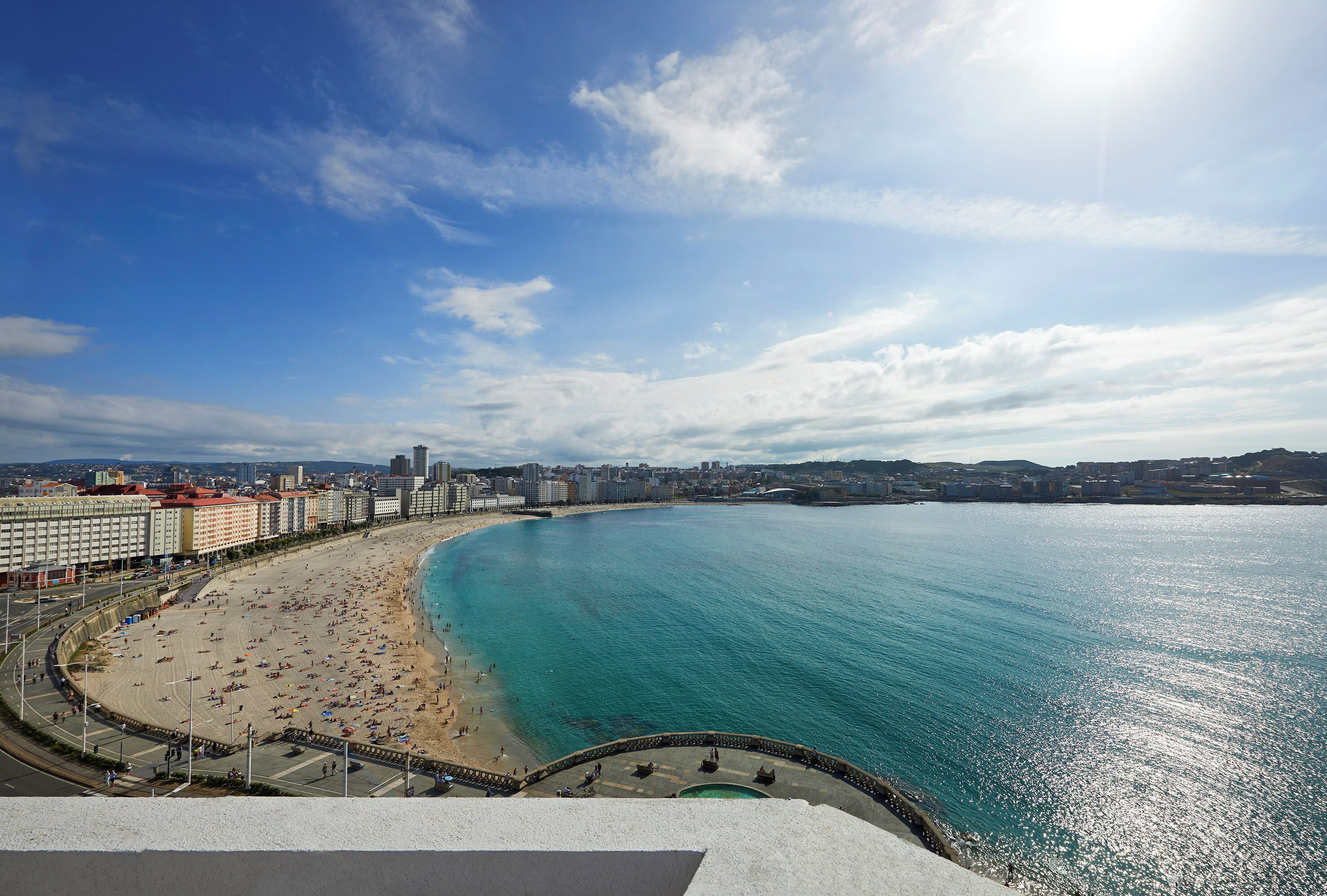 Beach nearby, white sand, beach towels