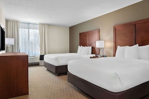 Premium bedding, desk, laptop workspace, blackout curtains