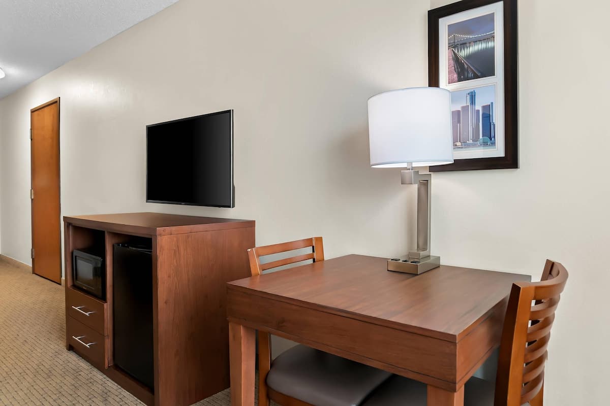 Premium bedding, desk, laptop workspace, blackout drapes