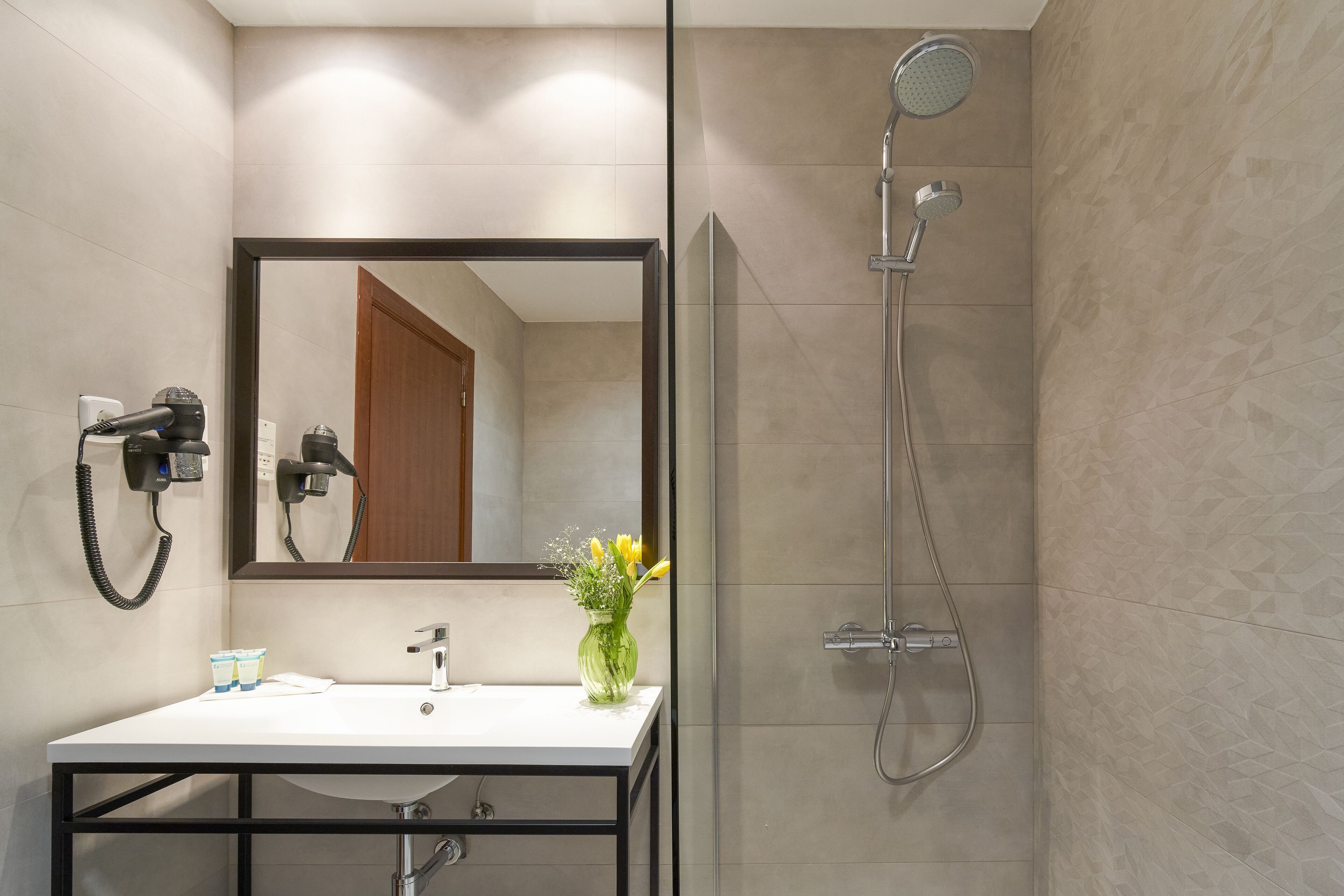 bathtub, free toiletries, hair dryer, towels