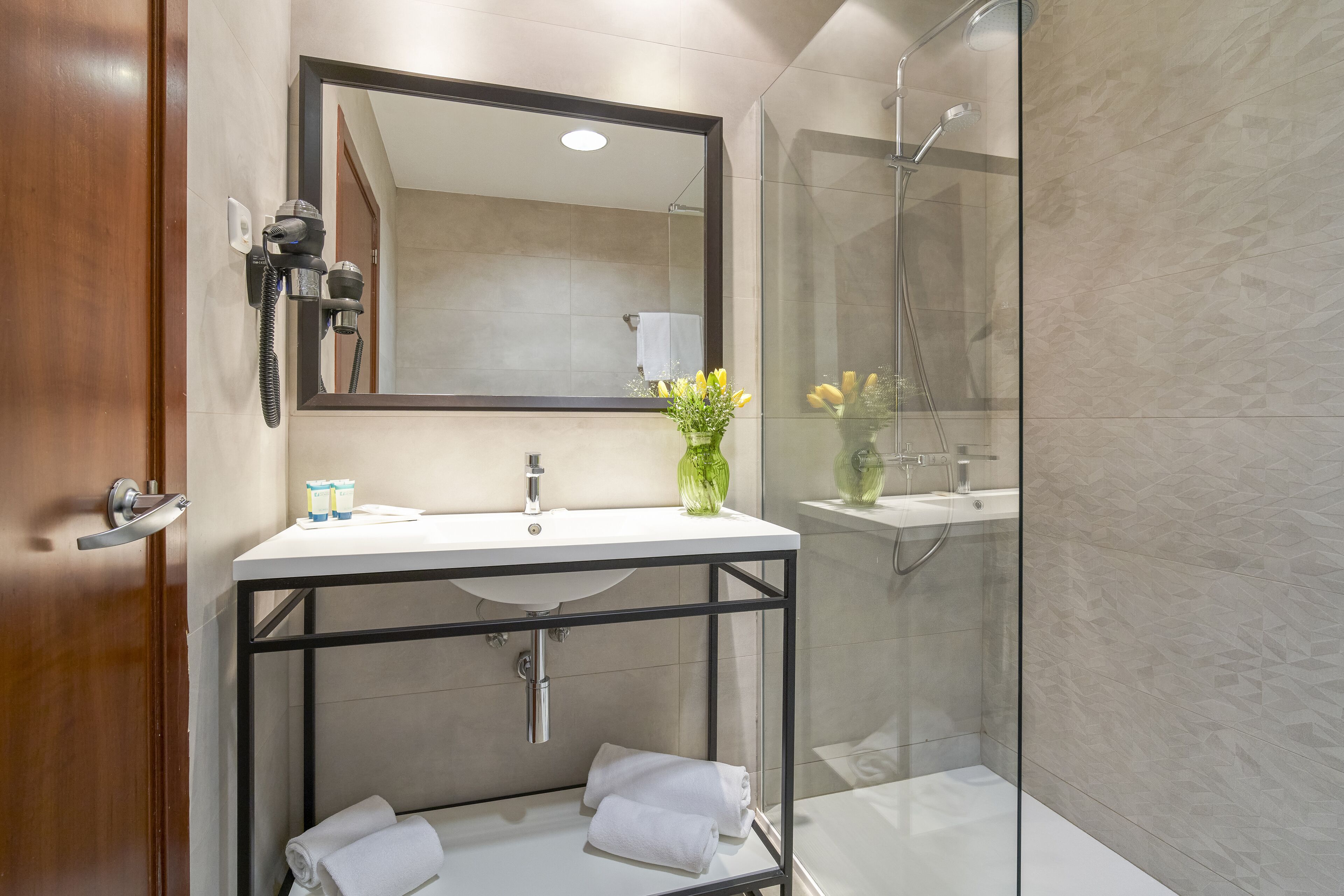 bathtub, free toiletries, hair dryer, towels