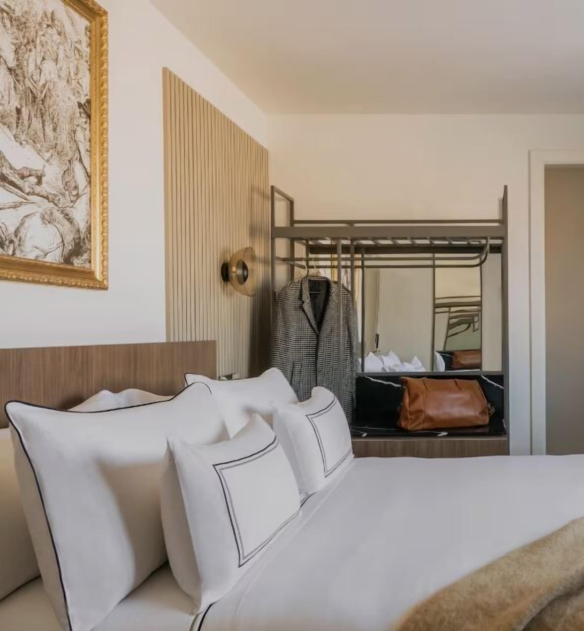 Premium bedding, down comforters, pillowtop beds, minibar
