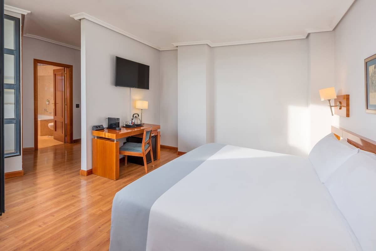 Premium bedding, down comforters, pillowtop beds, minibar