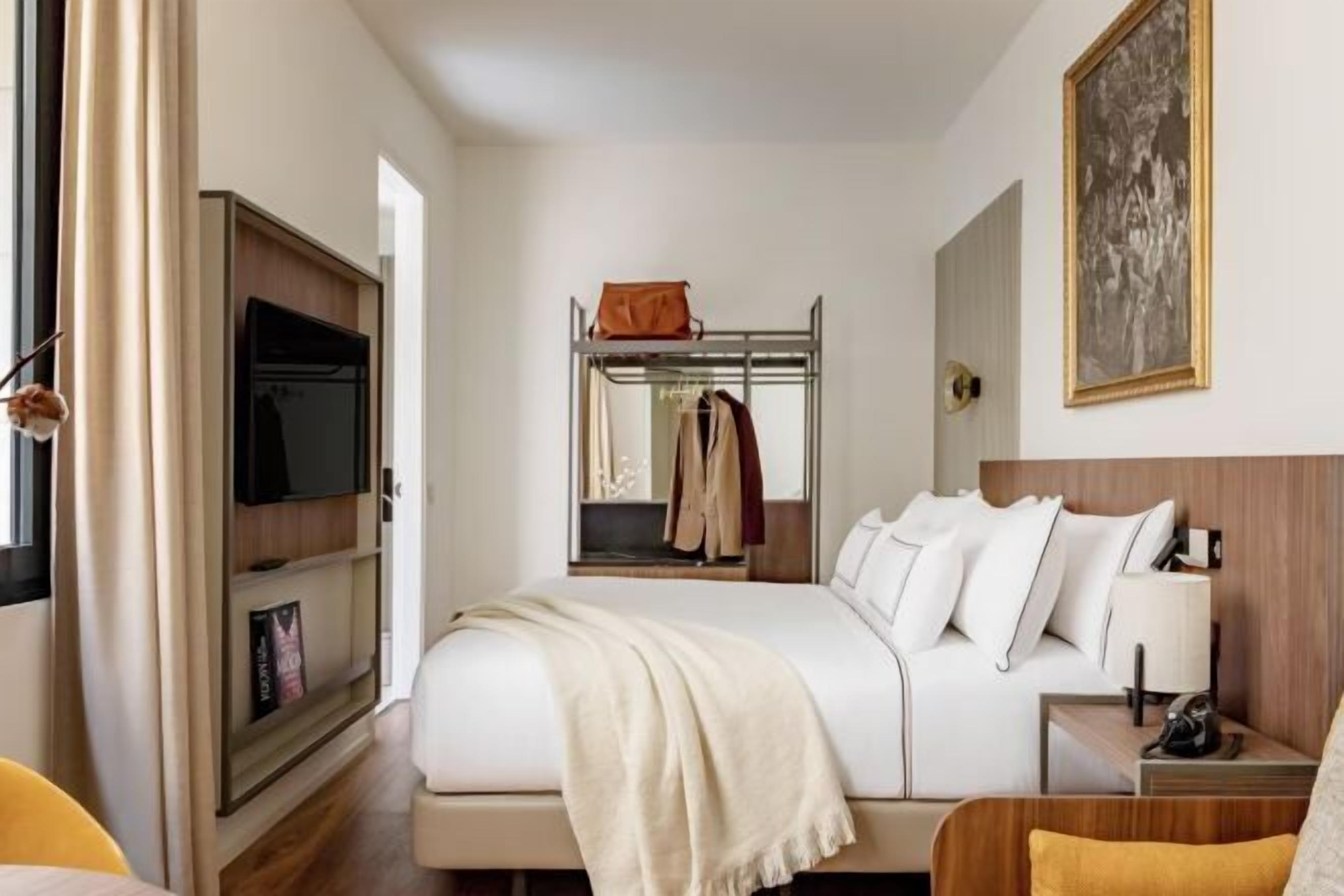Premium bedding, down comforters, pillowtop beds, minibar