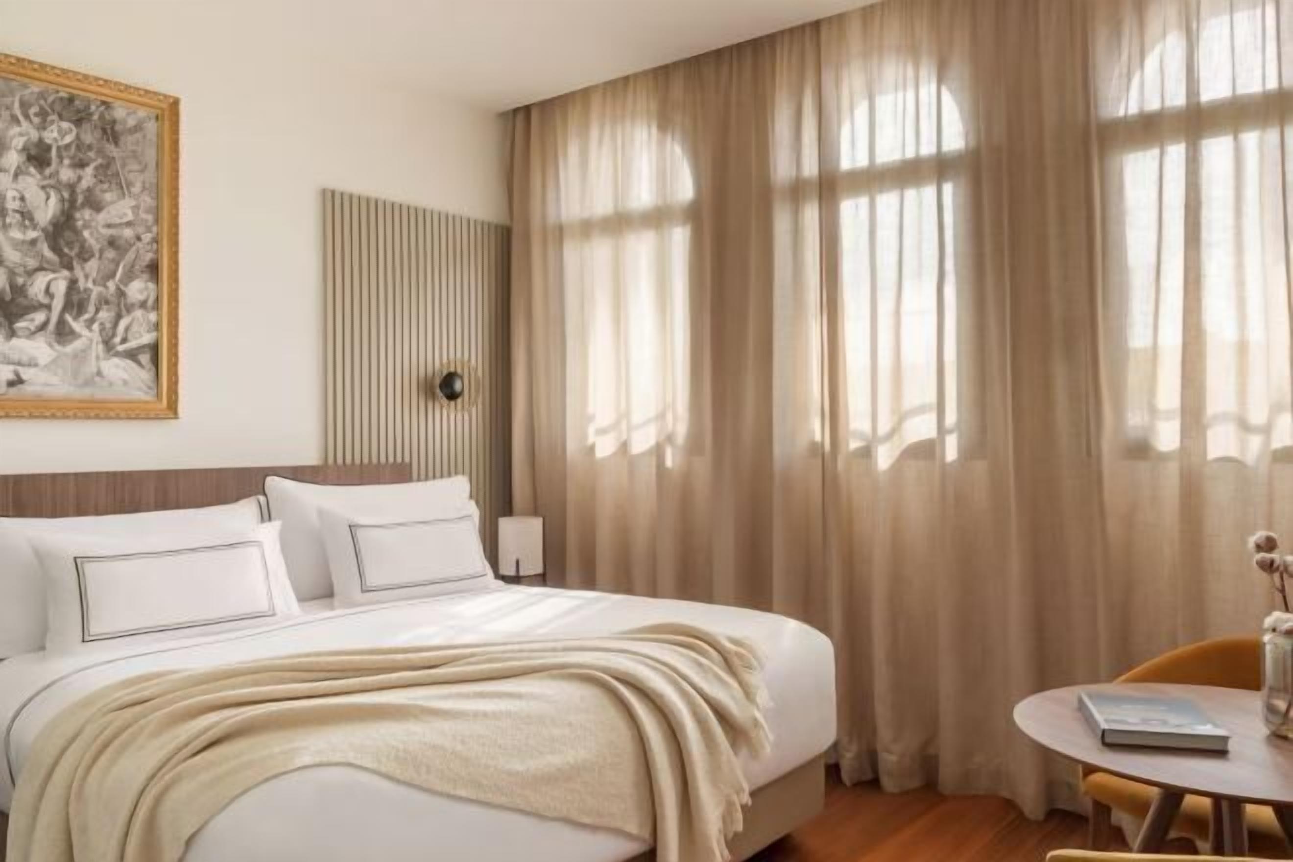 Premium bedding, down comforters, pillowtop beds, minibar