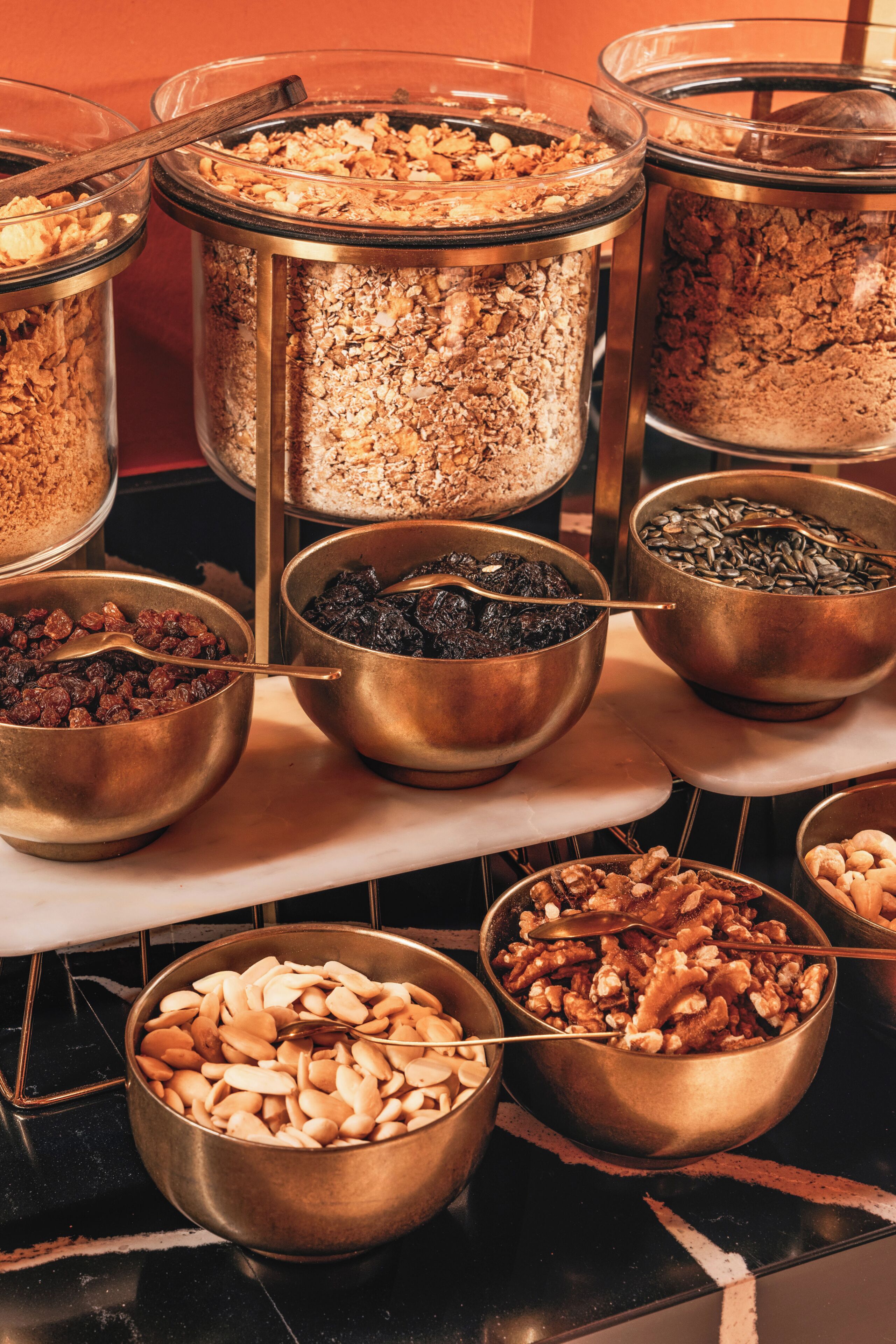 A variety of food items in metal containers on a countertop.