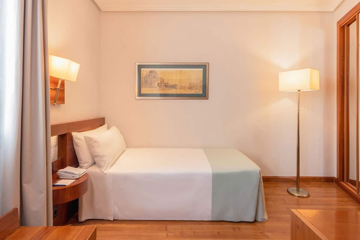 Premium bedding, down comforters, pillowtop beds, minibar