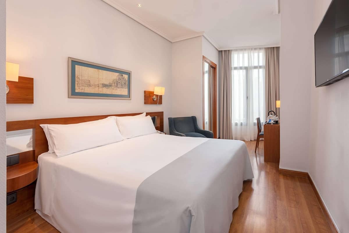 Premium bedding, down comforters, pillowtop beds, minibar