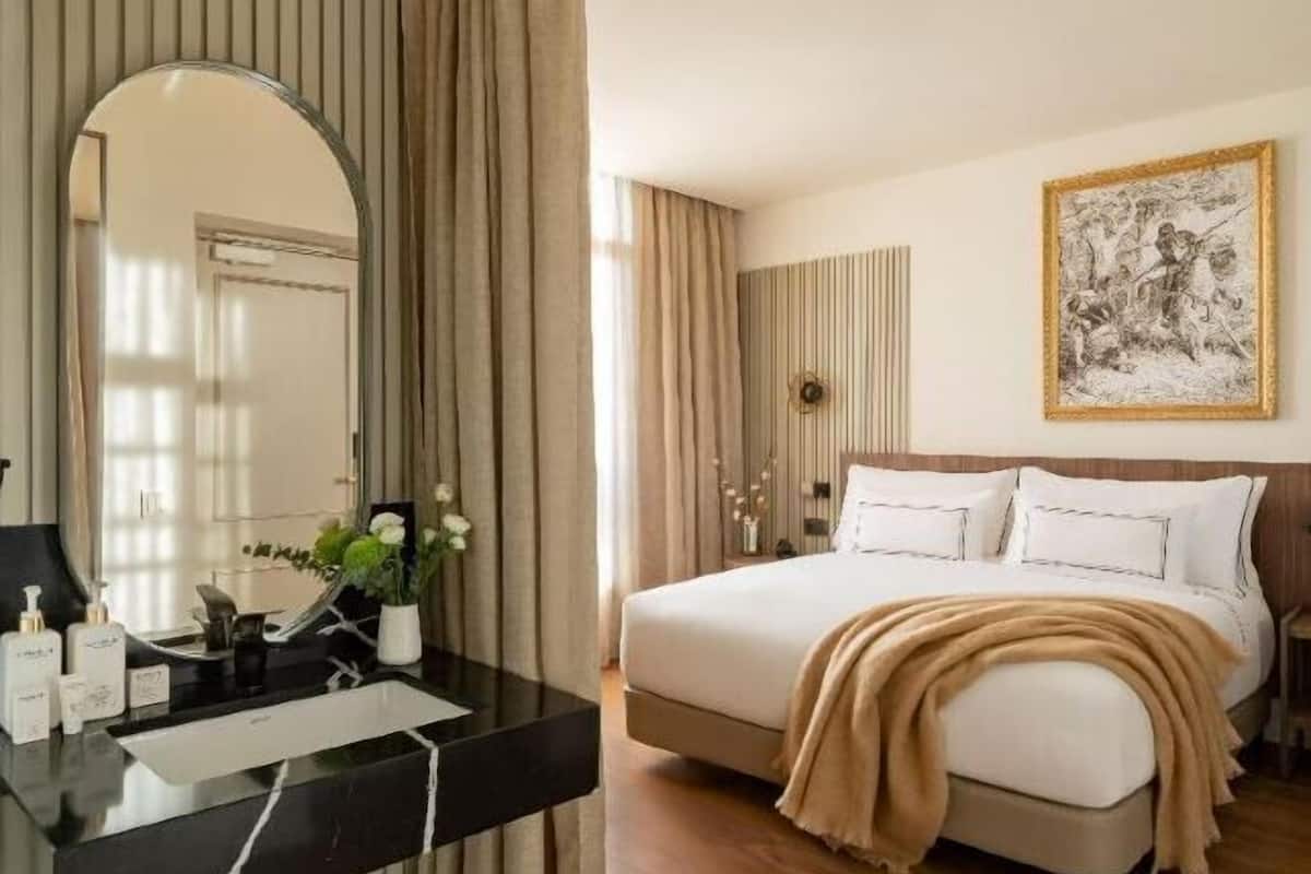 Premium bedding, down comforters, pillowtop beds, minibar