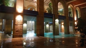 An indoor courtyard with stone columns, a central open space, and a pool. - Balneario de Mondariz (Mondariz-Balneario)