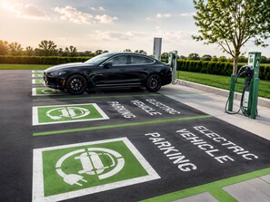 An electric vehicle charging station with a car parked nearby. - Holiday Inn Wilmington by IHG (Wilmington)