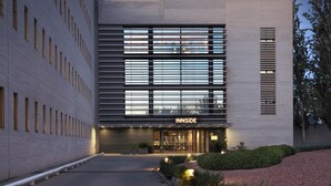 A modern building with a flat facade, large windows, and a sign reading "INNSIDE". - INNSiDE by Meliá Barcelona Aeropuerto (El Prat de Llobregat)