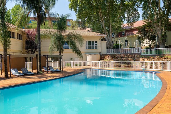 Outdoor pool, open 4:00 AM to 10:00 PM, pool umbrellas, pool loungers