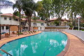 Outdoor pool, open 4:00 AM to 10:00 PM, pool umbrellas, pool loungers
