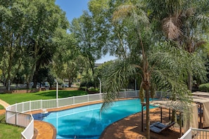 Outdoor pool, open 4:00 AM to 10:00 PM, pool umbrellas, sun loungers
