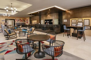 Relax in our spacious lobby with a comfortable seating area and stylish bar.