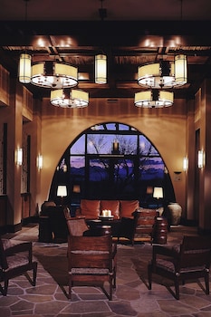 A resort with a pool, a golf course, and a lake. at Sheraton Grand at Wild Horse Pass