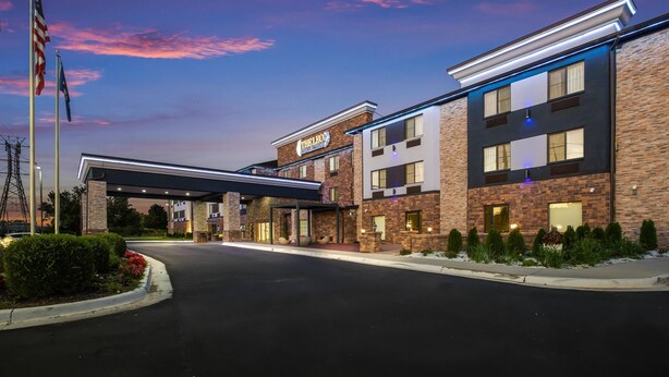 A hotel with a modern design, featuring a brick facade and a covered entrance. - The Leo Collection Detroit, an Ascend Collection Hotel (Lincoln Park)