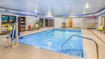 Indoor pool, open 10:00 AM to midnight, pool loungers