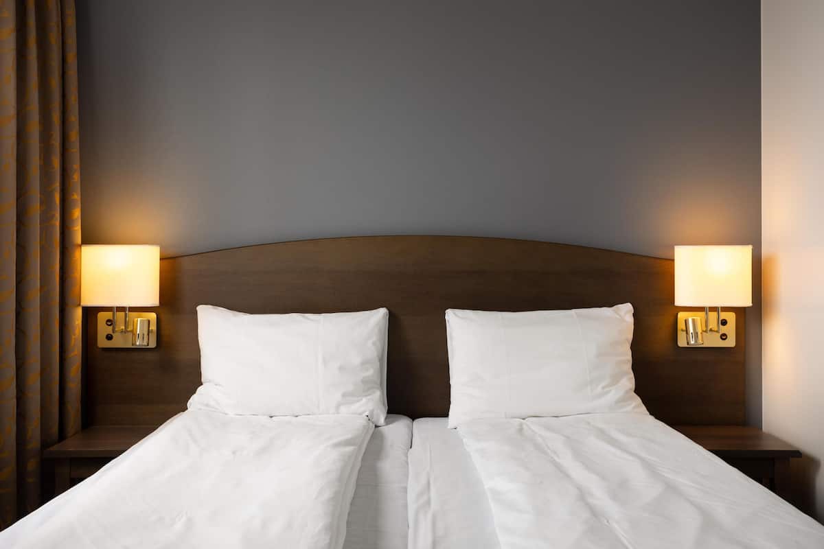 Twin Room | Premium bedding, desk, iron/ironing board, free cribs/infant beds