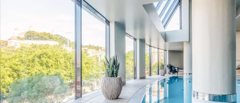 Indoor pool, open 8:00 AM to 8:00 PM, pool loungers