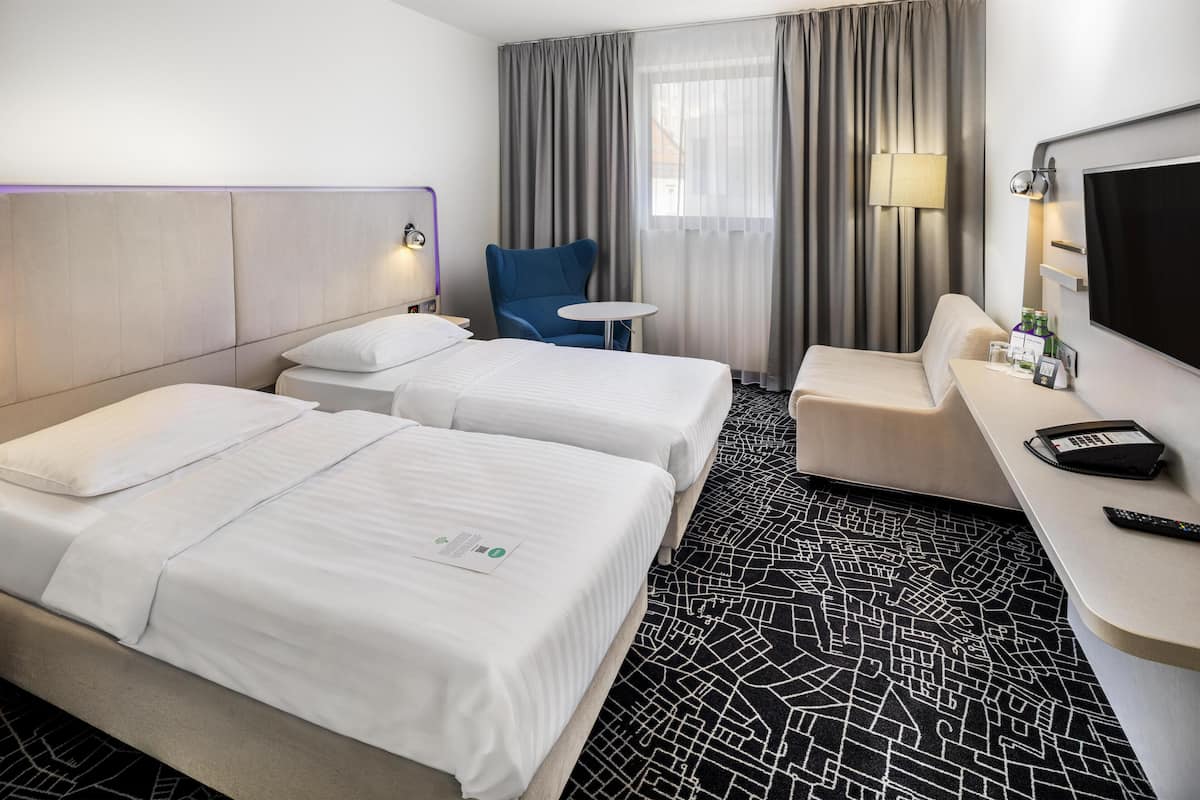 Family Room | Hypo-allergenic bedding available, minibar, in-room safe, desk