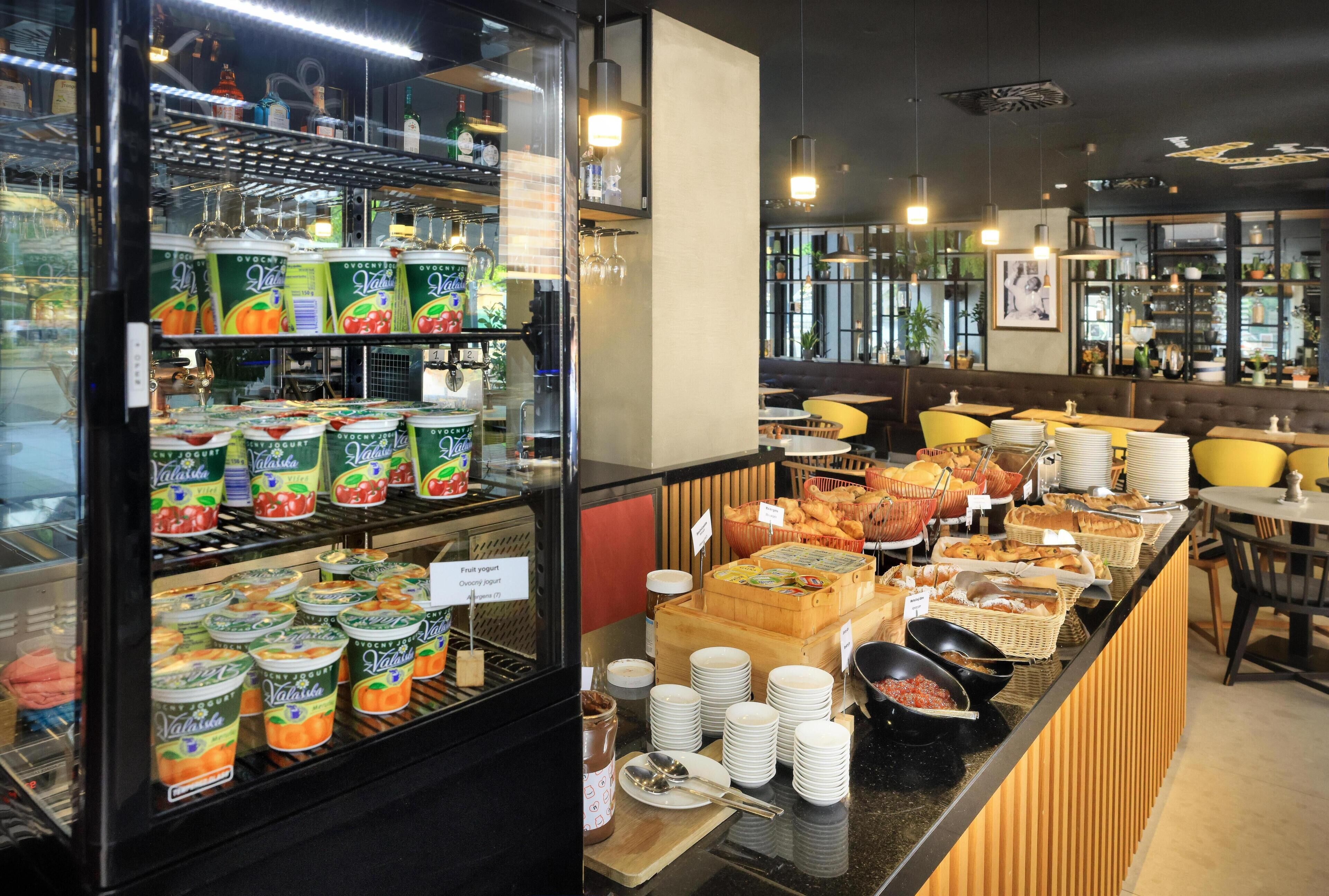 A breakfast buffet with various food items and beverages.