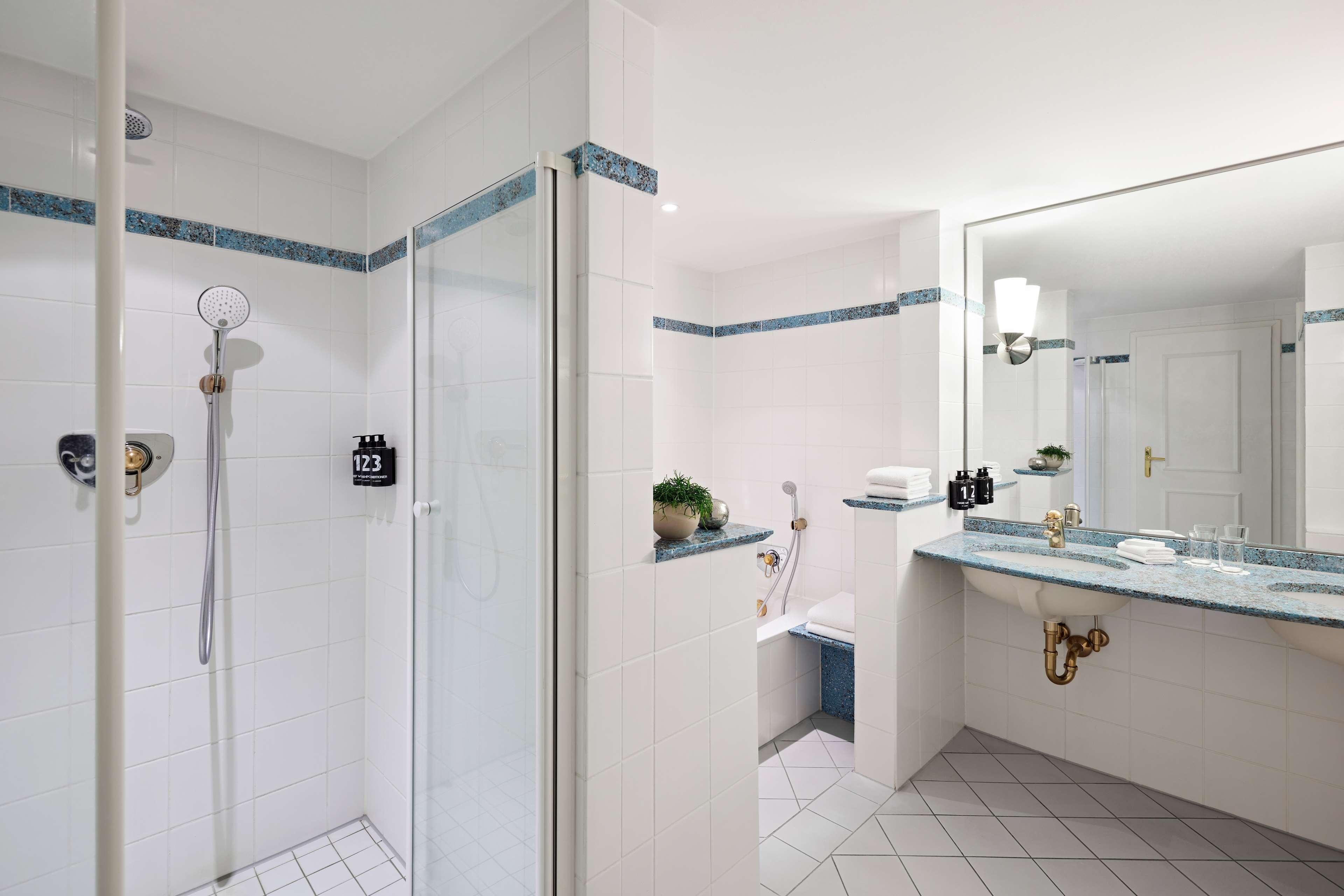 deluxe double room | bathroom | eco-friendly toiletries, hair dryer, bathrobes, towels