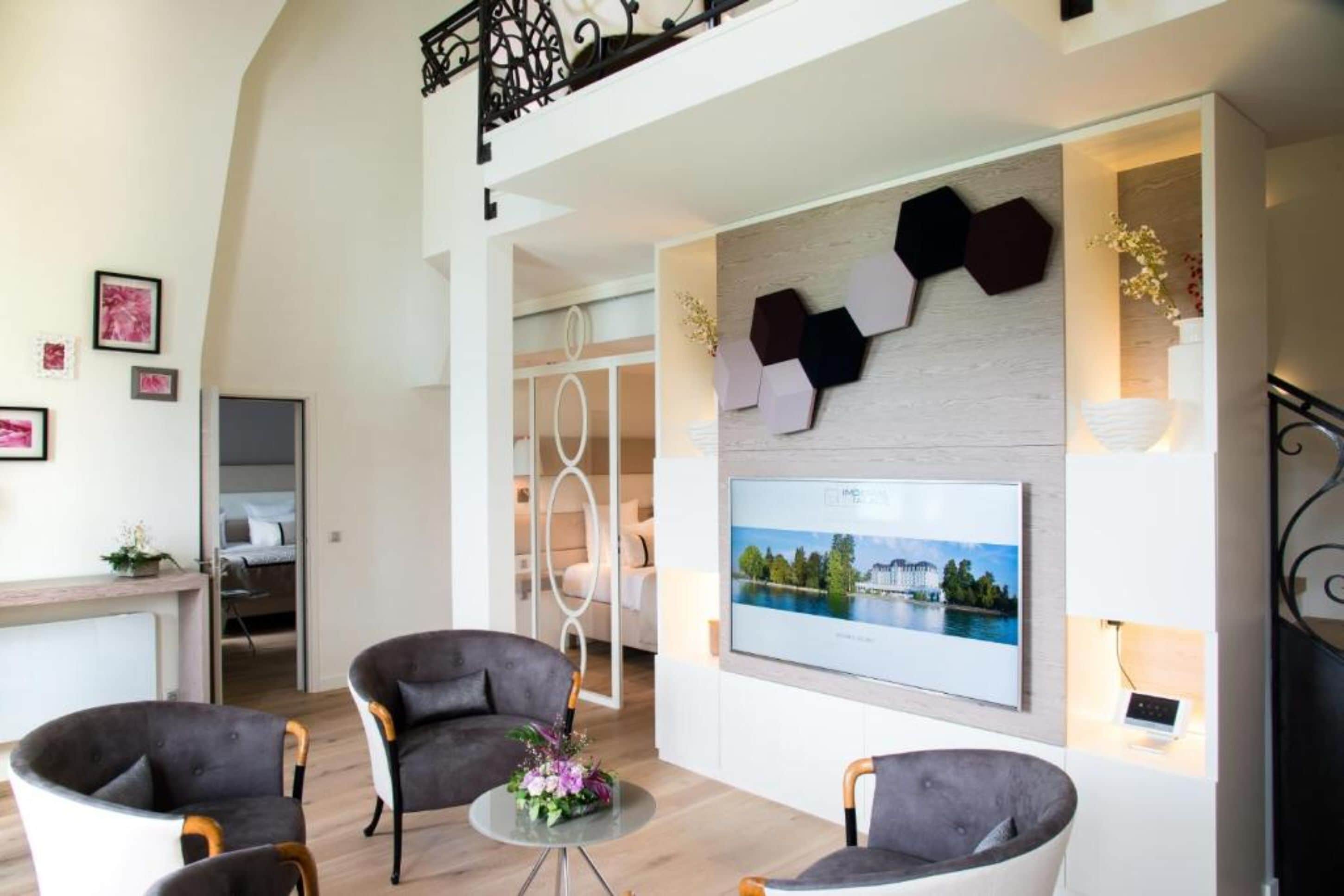 imperial suite with spa access on reservation | living area | flat-screen tv