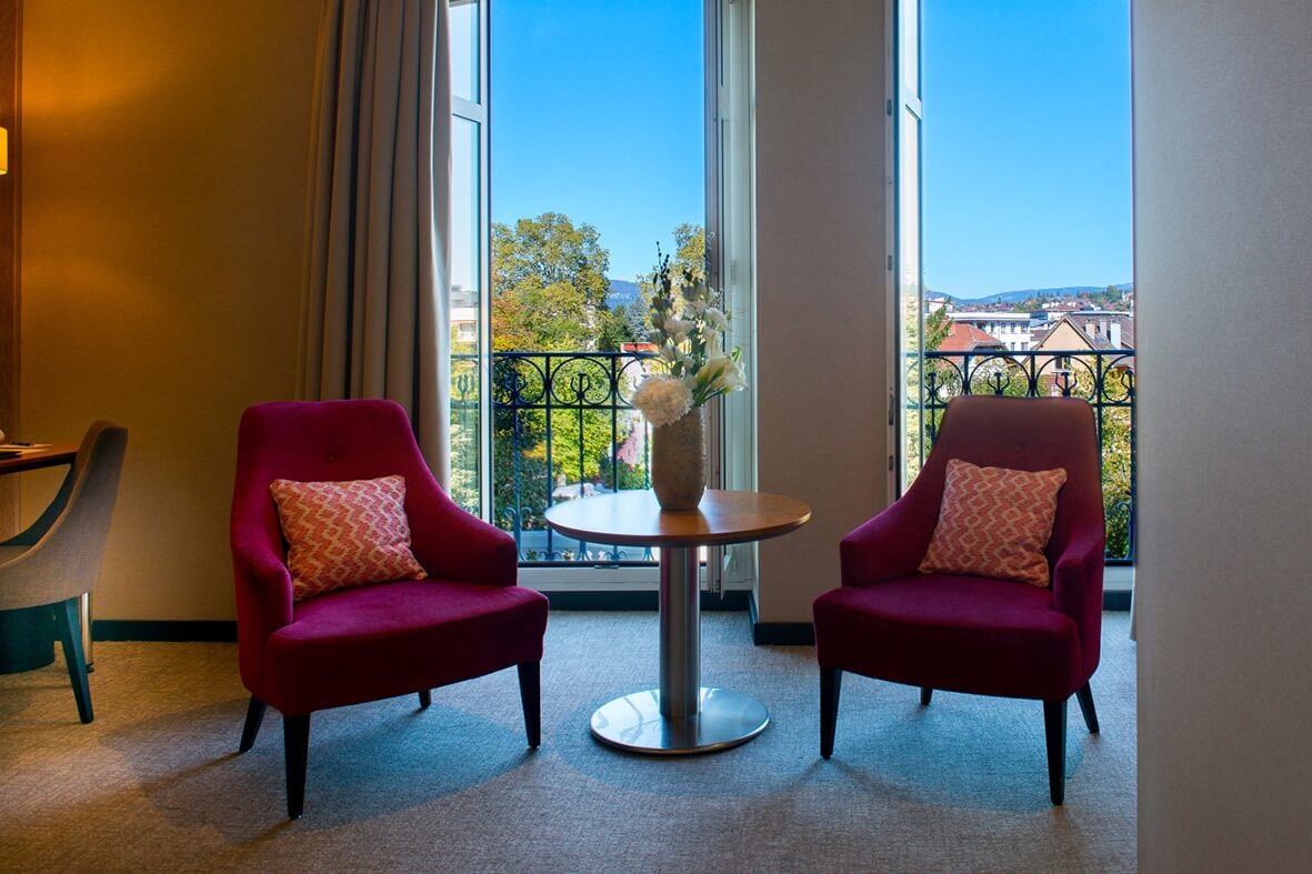 classic family queen room with spa access on reservation | living area | flat-screen tv