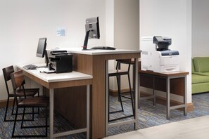 A hotel workspace with a desk, computer, printer, and a chair. - Holiday Inn Express & Suites Baltimore - BWI Airport North by IHG (Linthicum Heights)