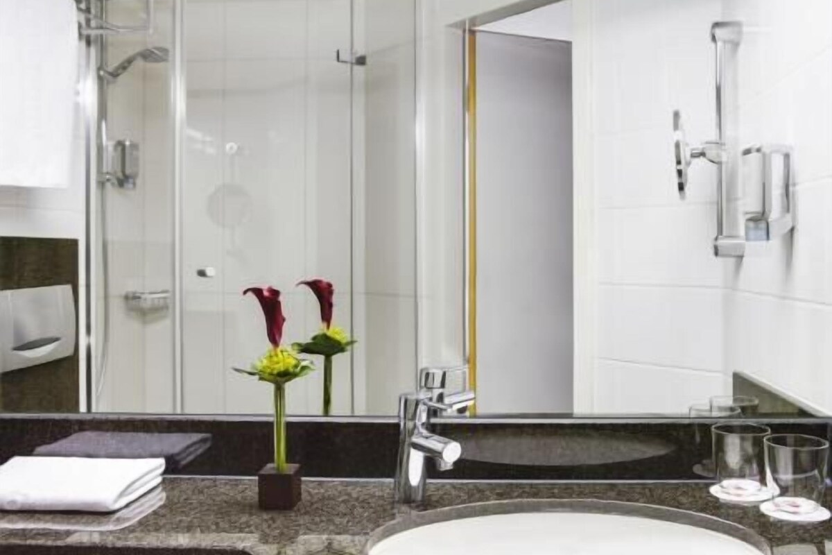 Bathroom | Shower, hair dryer, slippers, towels