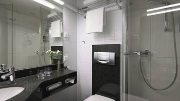 Shower, hair dryer, slippers, towels