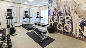 A gym with treadmills, a rowing machine, dumbbells, and a wall with motivational text. - SpringHill Suites by Marriott Austin Parmer/Tech Ridge (Austin)