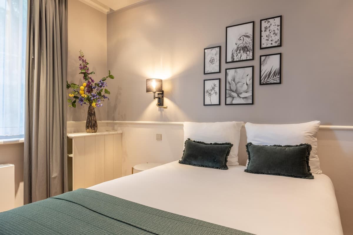 Departamento superior | Ropa de cama de alta calidad y minibar