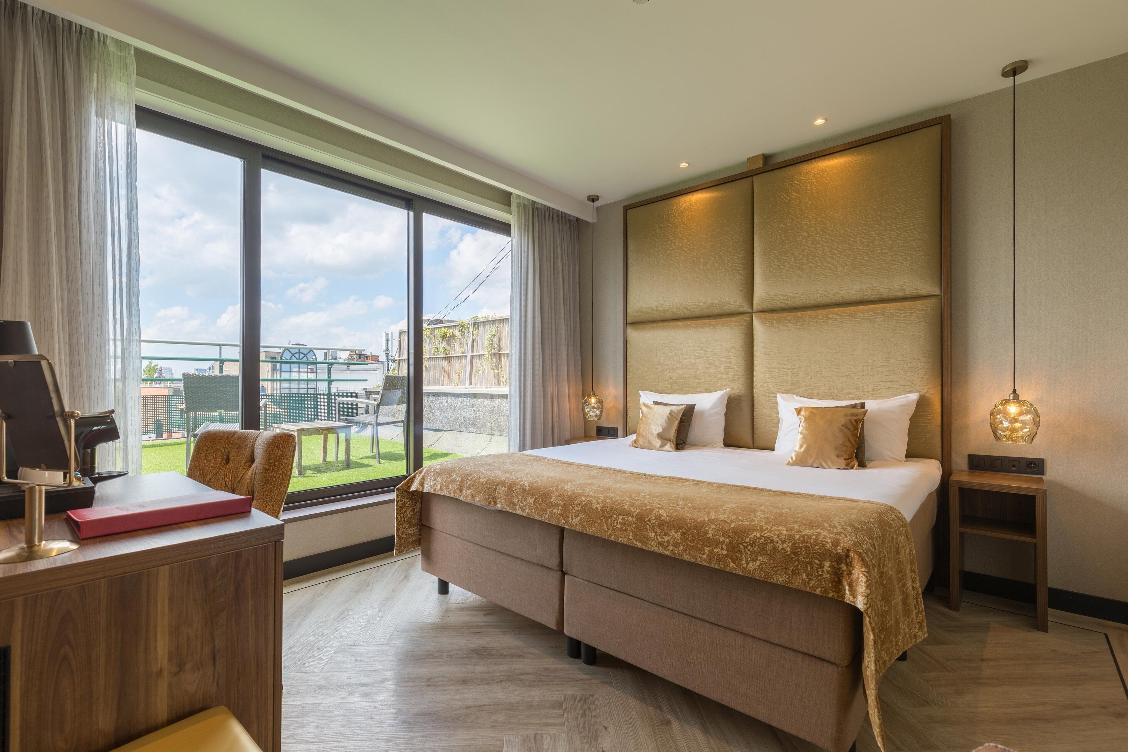 Chambre Confort, 1 lit double, terrasse | Literie de qualité supérieure, minibar, coffres-forts dans les chambres