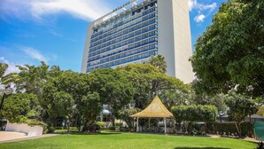 A hotel with a modern design, featuring a prominent building with a flat facade and a large number of windows. - The Jamaica Pegasus Hotel (Kingston)