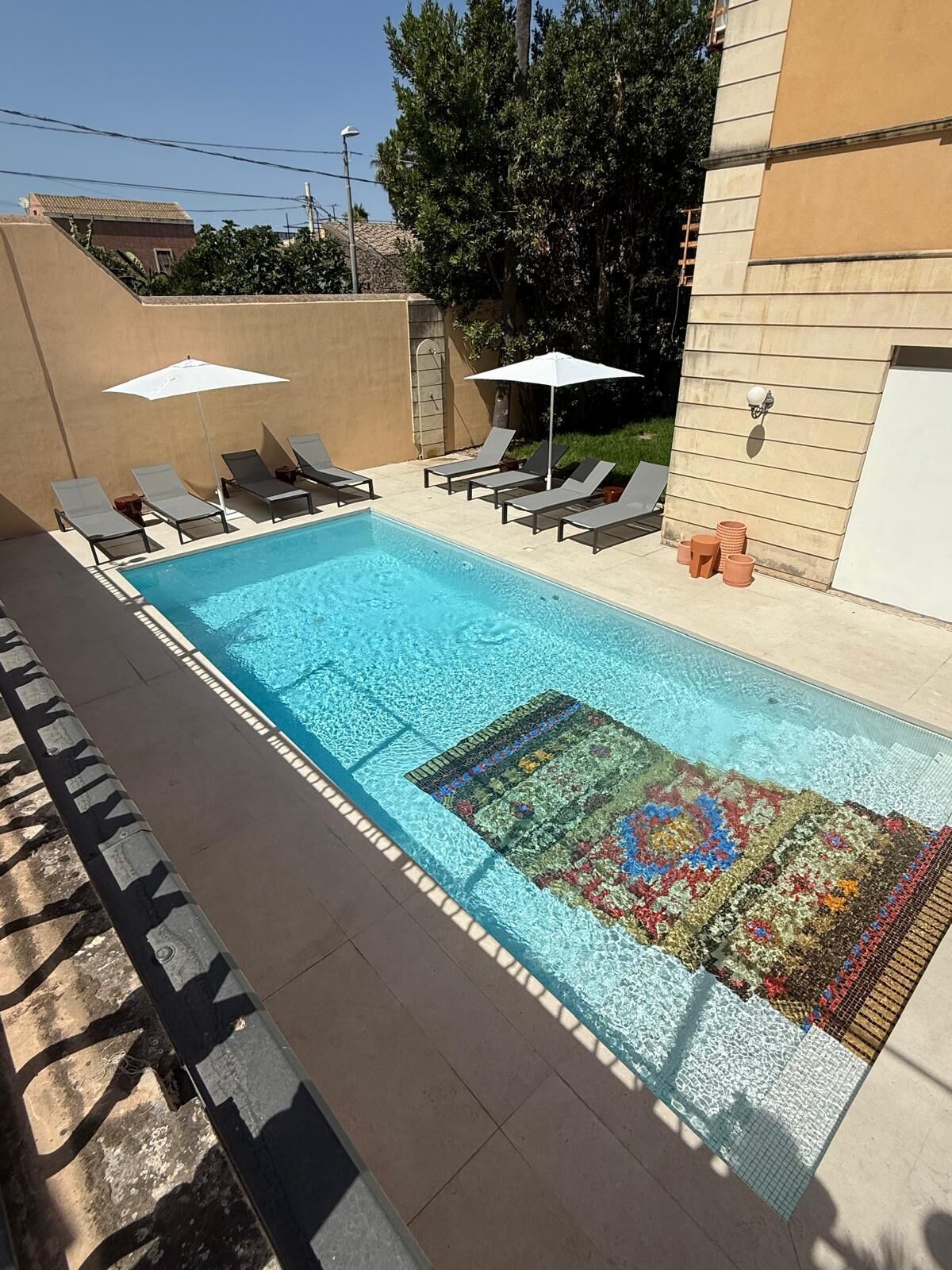 Outdoor pool, open 8:30 AM to 6:30 PM, pool umbrellas, pool loungers