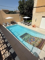 Outdoor pool, open 8:30 AM to 6:30 PM, pool umbrellas, sun loungers