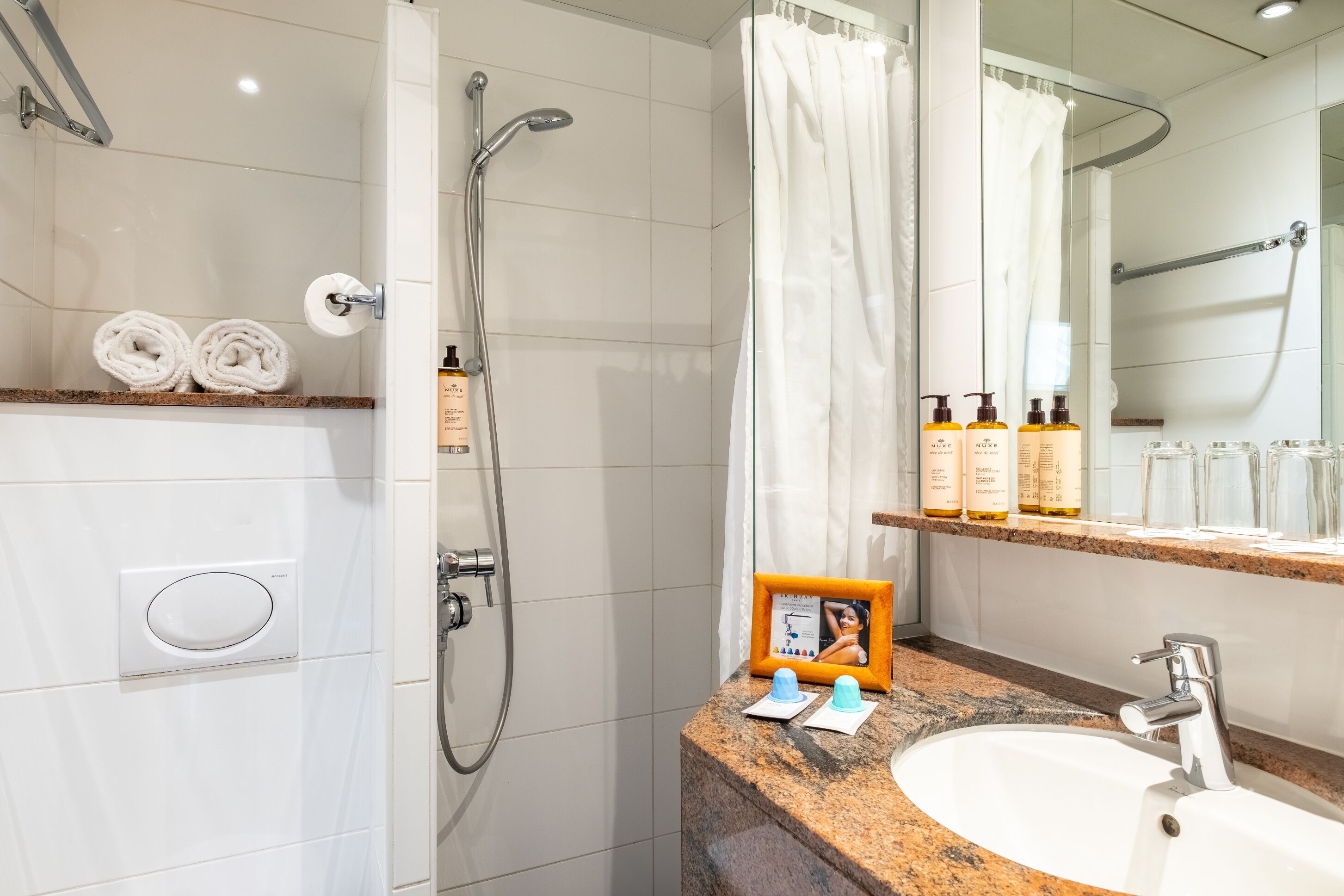 room with eiffel tower view | bathroom | shower, eco-friendly toiletries, hair dryer, slippers