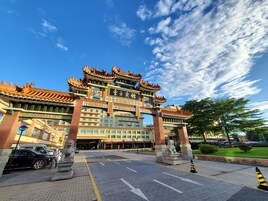 A traditional Chinese building with ornate architecture, including a multi-tiered roof and decorative elements.